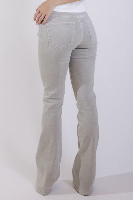 image of a female model wearing a JAXTYN HIGH RISE BOOTCUT JEANS OYSTER GREY DEAR JOHN DENIM 