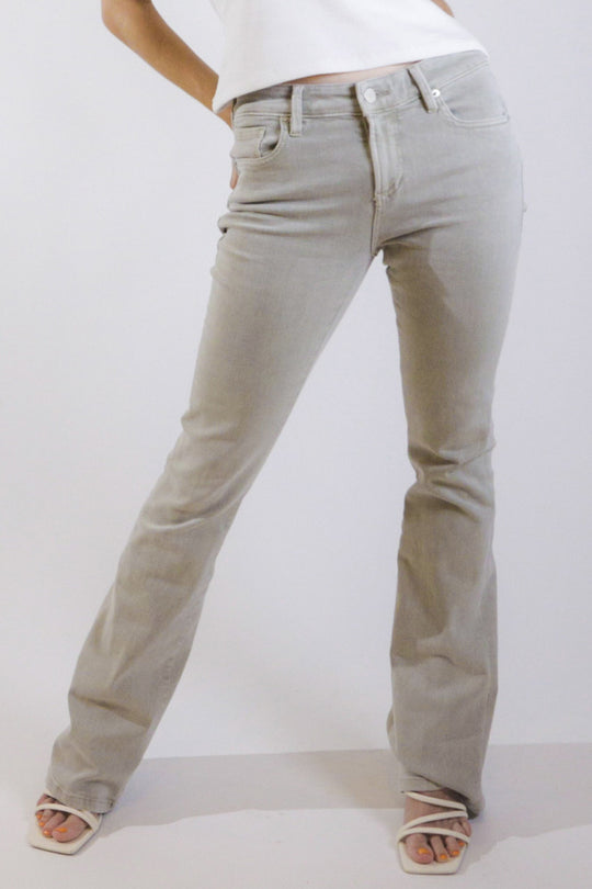 image of a female model wearing a JAXTYN HIGH RISE BOOTCUT JEANS OYSTER GREY DEAR JOHN DENIM 