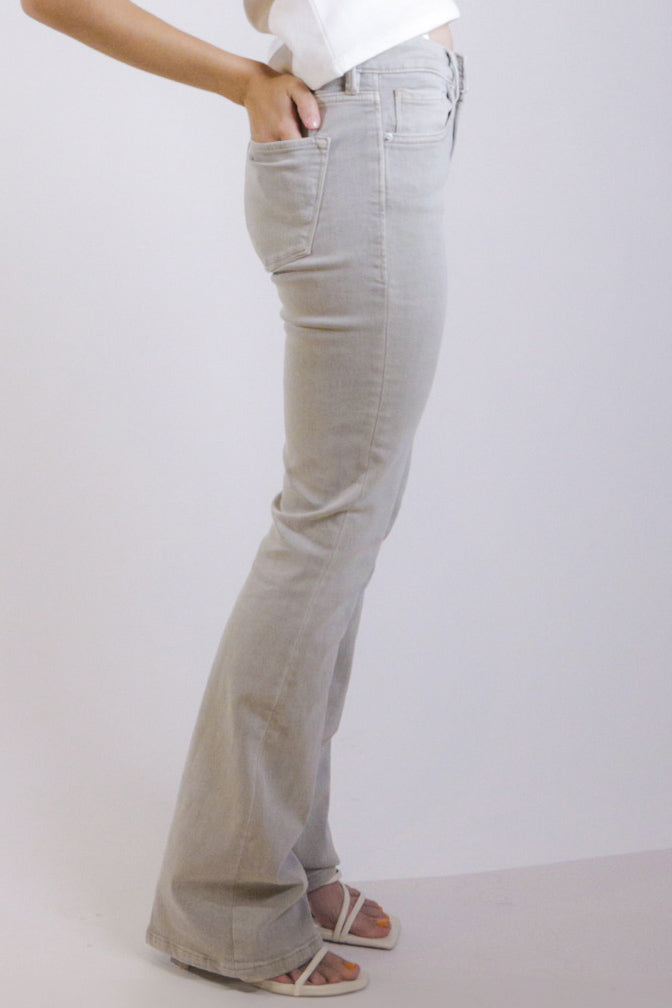 image of a female model wearing a JAXTYN HIGH RISE BOOTCUT JEANS OYSTER GREY DEAR JOHN DENIM 