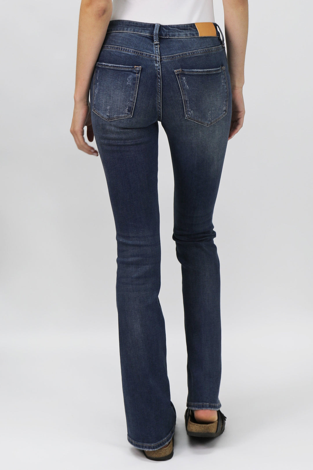 image of a female model wearing a JAXTYN HIGH RISE BOOTCUT JEANS MILLBRIDGE DEAR JOHN DENIM 