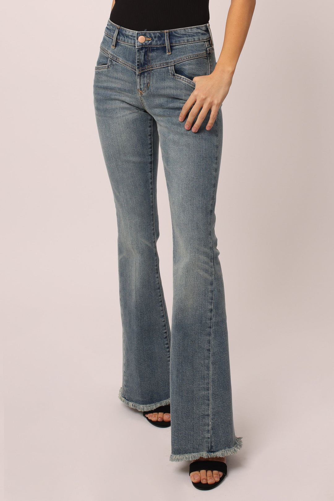 image of a female model wearing a ROSA HIGH RISE FLARE JEANS STOKES CANYON DEAR JOHN DENIM 