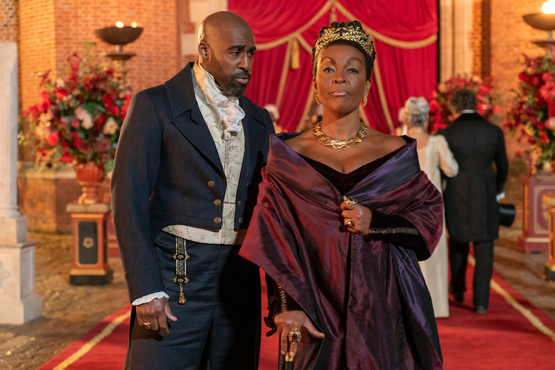  Daniel Francis as Lord Anderson and Adjoa Andoh as Lady Agatha Danbury enter a ball together in season 3 of 'Bridgerton'