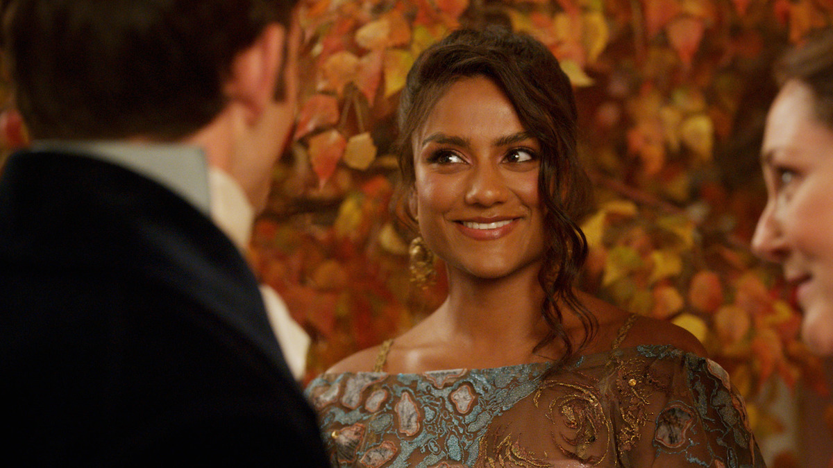 Simone Ashley as Kate Sharma smiles at a ball in Season 3 of 'Bridgerton'