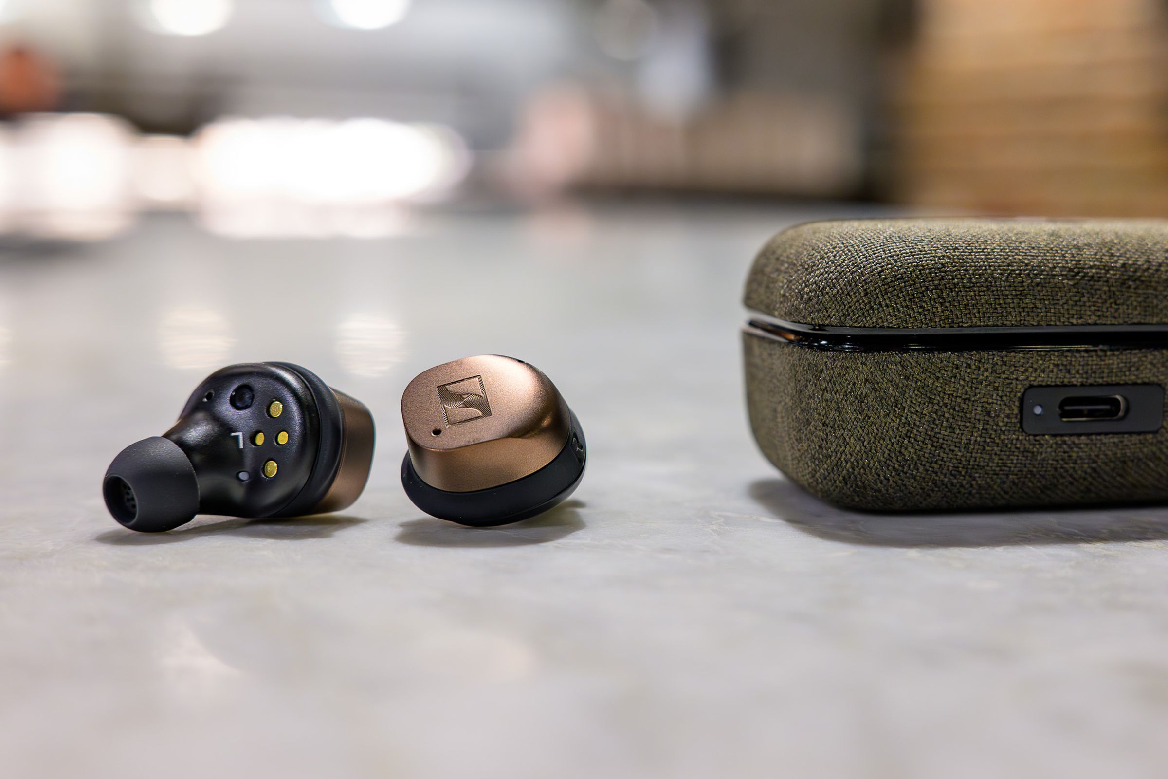 A photo of Sennheiser’s Momentum True Wireless 4 earbuds in copper.