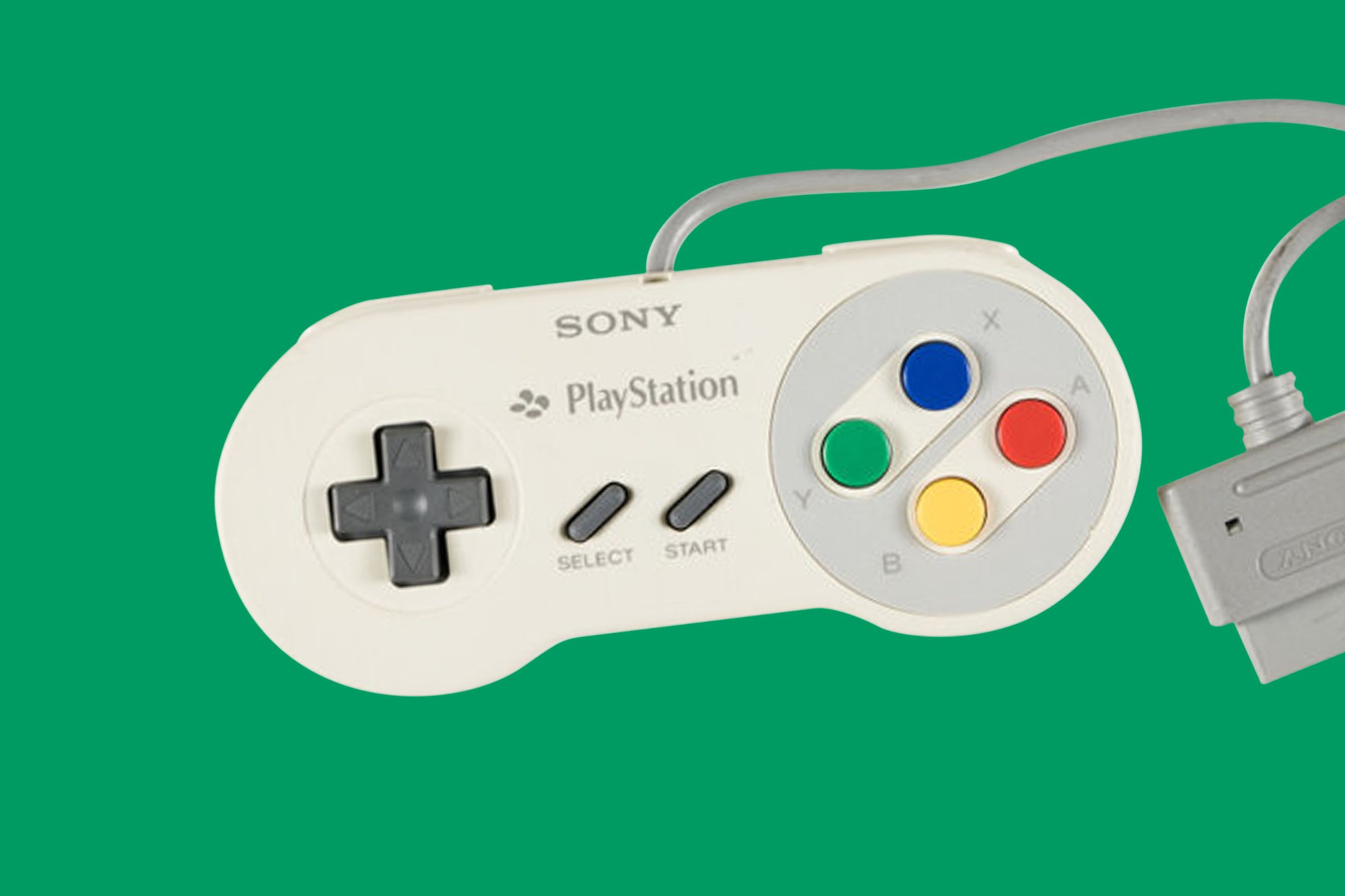 An image of a rare Nintendo Playstation controller on a green background.