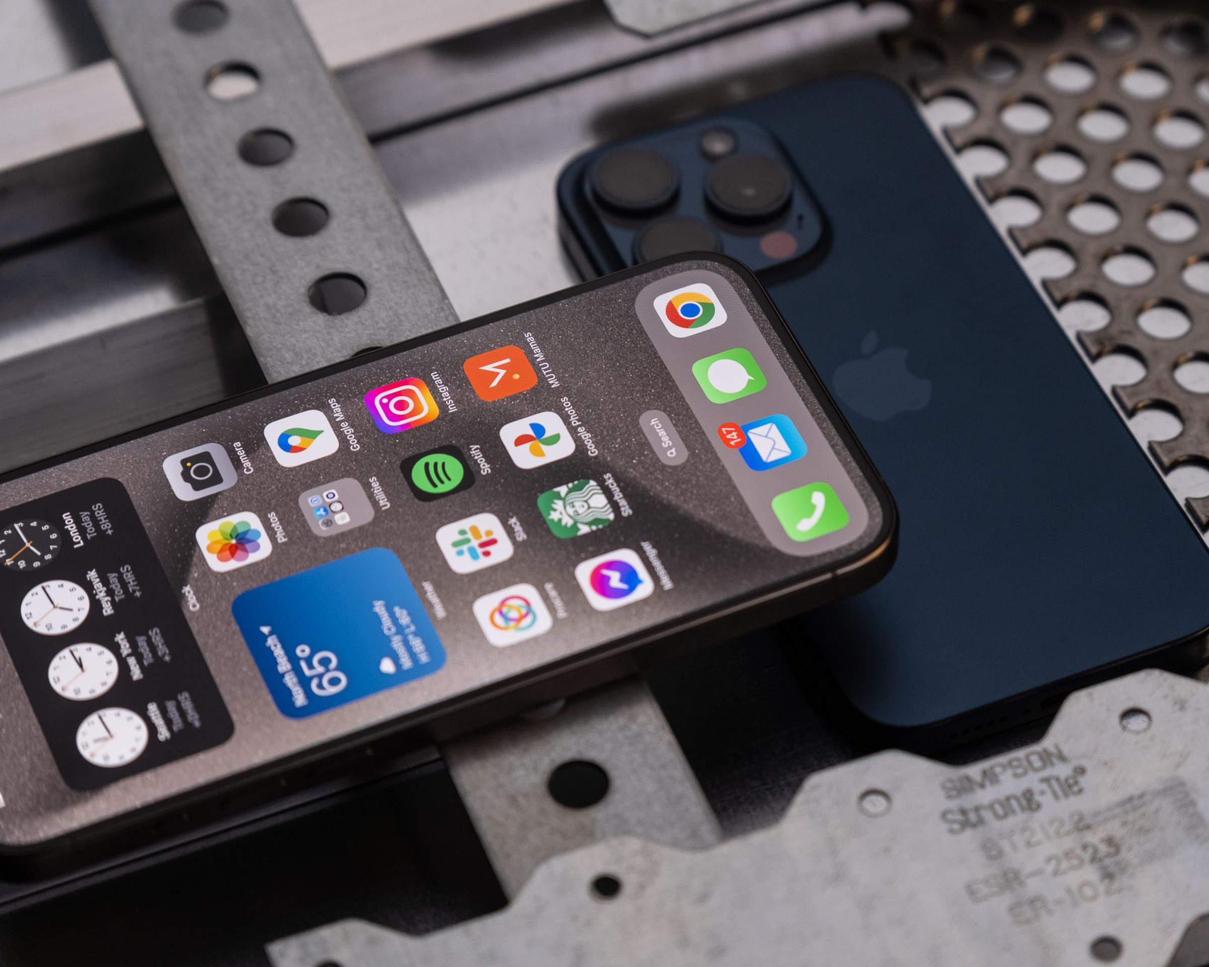 Photo of iPhone 15 Pro surrounded by metal.