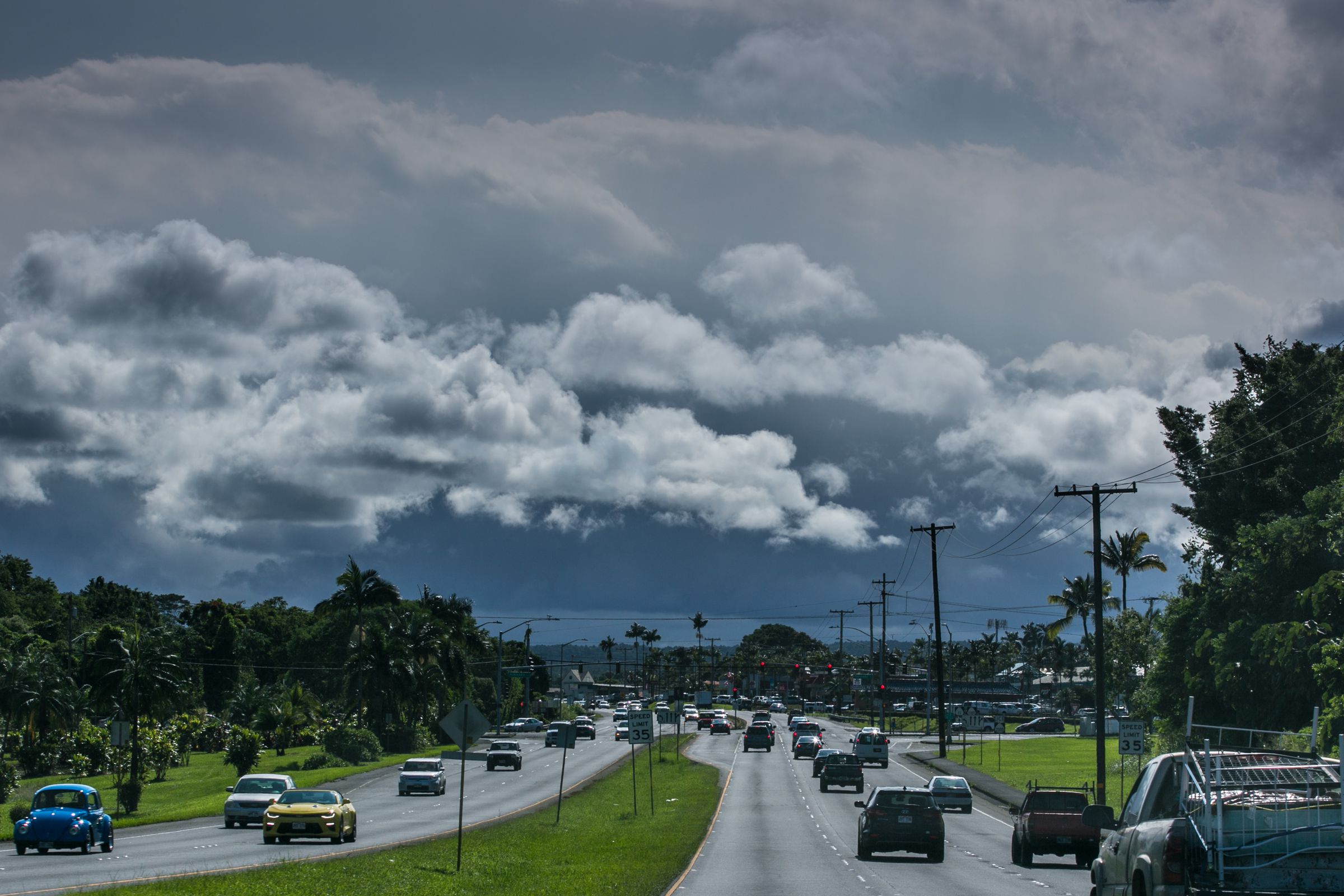 Cars drive down a highway.