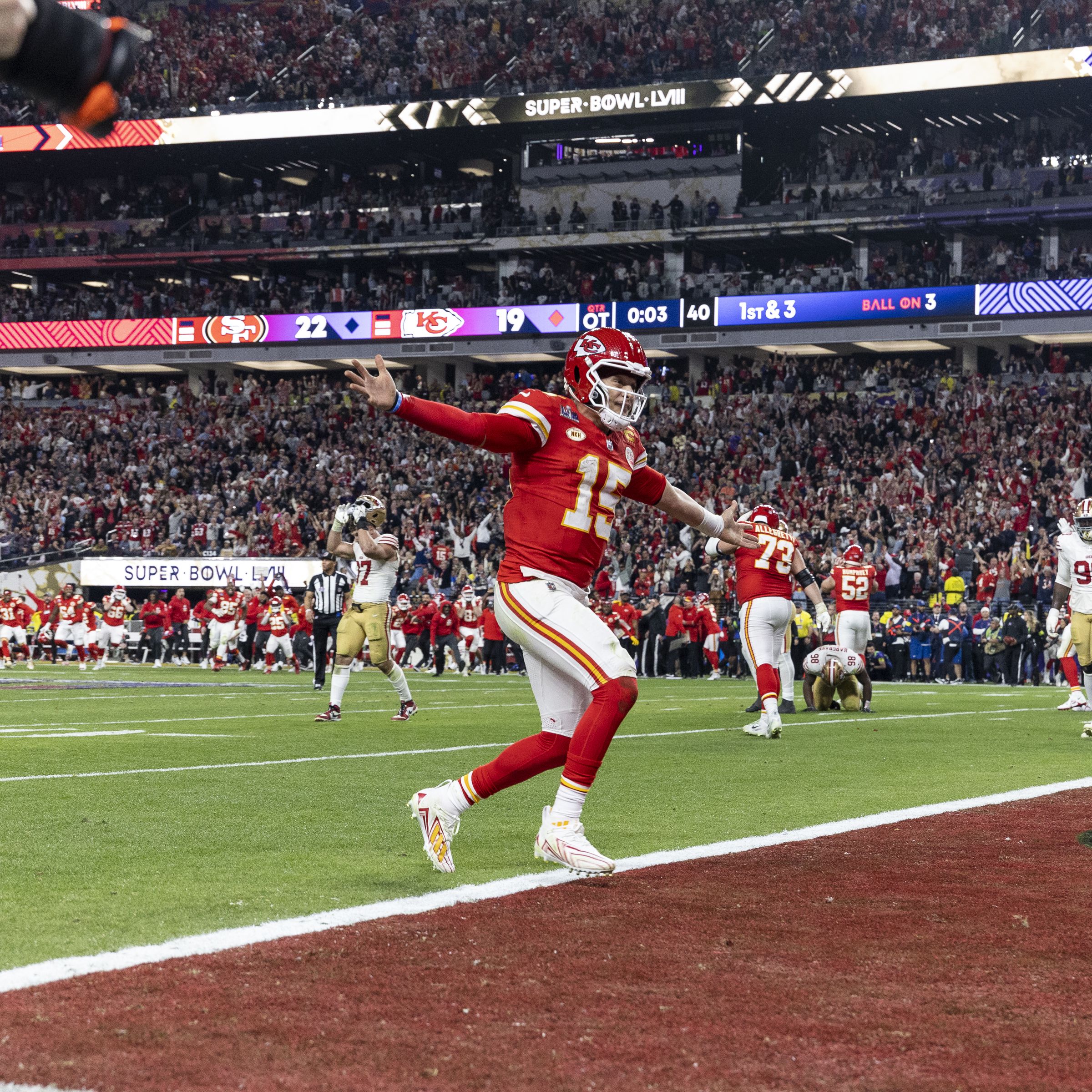 Patrick Mahomes holding a football during Super Bowl LVIII.