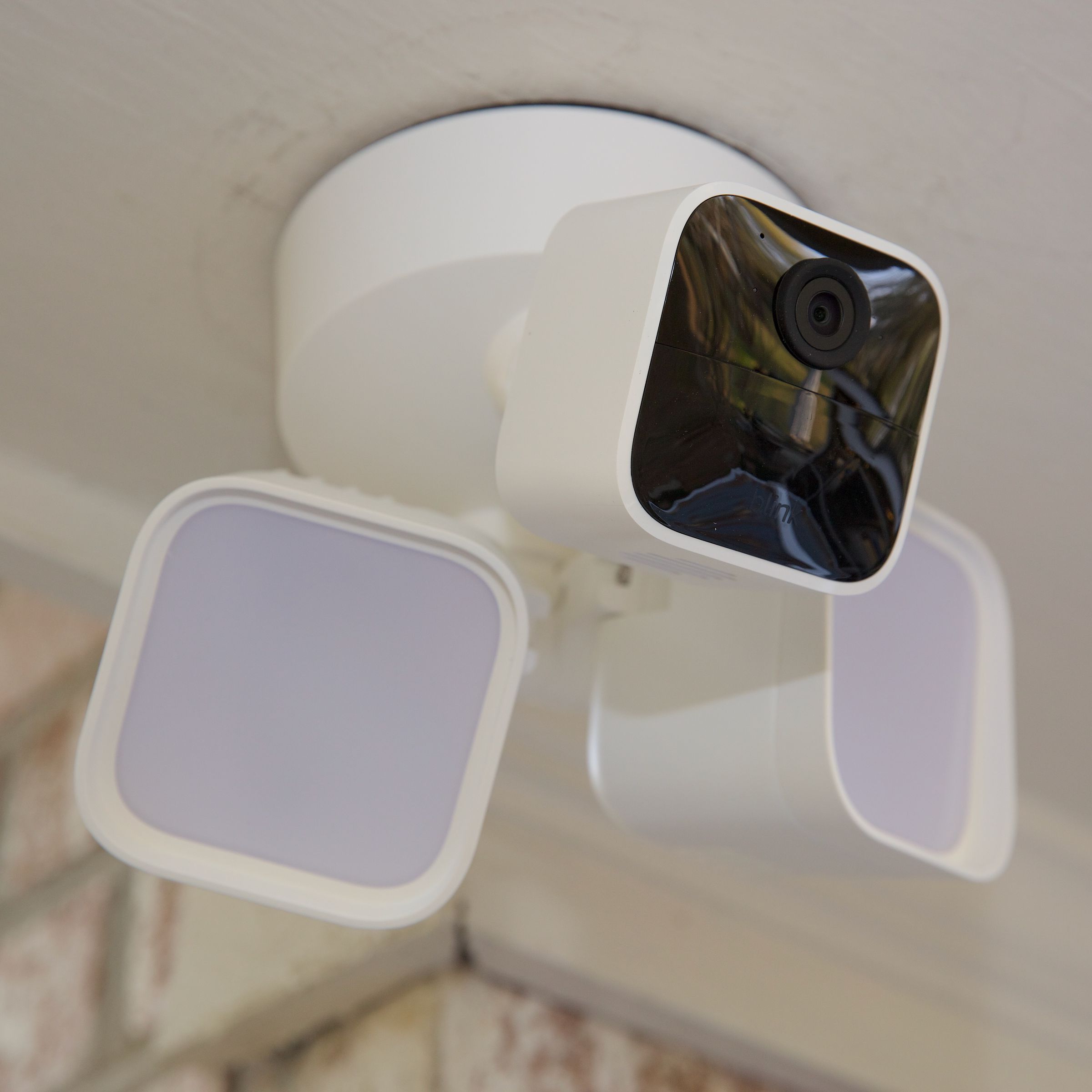 Blink’s Wired Floodlight Camera mounted up on a porch.