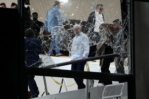 Brazil's President Luiz Inacio Lula da Silva surveys the damage of the Planalto presidential palace after it was stormed by supporters of former President Jair Bolsonaro, in Brasilia, Brazil, Jan. 8, 2023