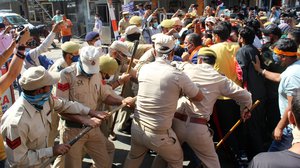 Activists raise slogans during a protest against derogatory remarks by Jammu and Kashmir National Conference President Farooq Abdullah regarding Article 370, in Jammu,India, 14 October 2020.