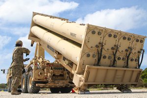 U.S. Army Cpl. Rogelio Argueta, Patriot Launching Station Enhanced Operator-Maintainer, assigned with Task Force Talon, 94th Army Air and Missile Defense Command gives commands, during a practice missile reload and unload drills on a Terminal High Altitude Area Defense (THAAD) system trainer at Andersen Air Force Base, Guam, Feb. 6, 2019.