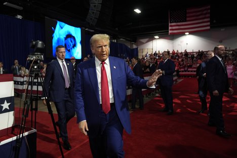 Republican presidential nominee former President Donald Trump waves to supporters at a campaign town hall at the Greater Philadelphia Expo Center & Fairgrounds, Monday, Oct. 14, 2024, in Oaks, Pa.