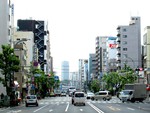 Regular traffic with a wide, one-way road at Tokyo, Japan. Taken on May 2014.