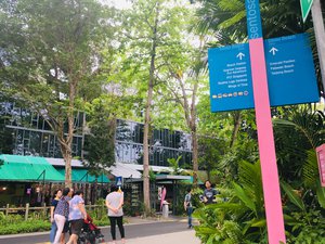 People strolling on beach road in Sentosa, Singapore. Taken on September 2018.