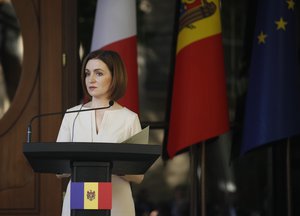 Moldova's President Maia Sandu pauses as she speaks to the media during a conference at the Presidential Palace in Chisinau, Moldova, Wednesday, June 15, 2022.