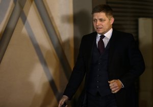 Chairman of the SMER-Social Democracy party Robert Fico arrives at its party's headquarters to watch the results of the general elections in Bratislava, Slovakia, Saturday, March 5, 2016.