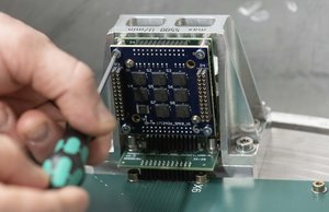 European Chips Act - Car sensor production site (Reutlingen, Germany) - An employee of Bosch mounting a board with acceleration sensors in a centrifuge