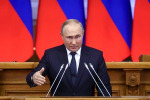 Russian President Vladimir Putin gestures while addresses a meeting of the Council of Legislators under the Russian Federal Assembly at the Tauride Palace, in St. Petersburg, Russia, Wednesday, April 27, 2022.