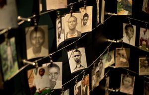 In this Saturday, April 5, 2014 file photo, family photographs of some of those who died hang in a display in the Kigali Genocide Memorial Centre in Kigali, Rwanda