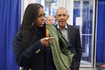 Former first lady Michelle Obama, left, and former President Barack Obama arrive to cast their ballots at an early voting site Monday, Oct. 17, 2022, in Chicago