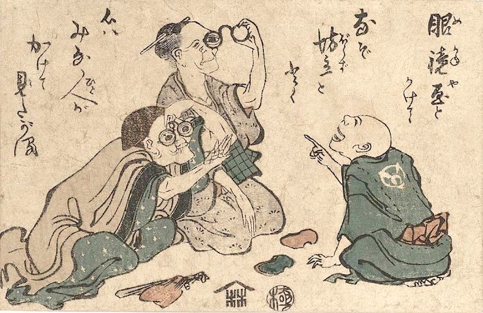 眼鏡を試す江戸時代のおじいちゃんとおばあちゃん（葛飾北斎 画）