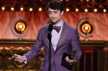 Daniel Radcliffe accepts the Best Performance by an Actor in a Featured Role in a Musical award for "Merrily We Roll Along" onstage during The 77th Annual Tony Awards at David H. Koch Theater at Lincoln Center on June 16, 2024 in New York City.