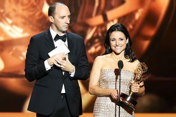 Winner of Best Supporting Actor in a Comedy Series Tony Hale and winner of Best Lead Actress in a Comedy Series, Julia Louis-Dreyfus speak onstage during the 65th Annual Primetime Emmy Awards held at Nokia Theatre L.A. Live on September 22, 2013 in Los Angeles, California.