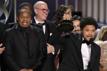 Roy Wood Jr. and Trevor Noah (C) and cast and crew accept the Outstanding Variety Series award for "The Daily Show with Trevor Noah" onstage during the 75th Primetime Emmy Awards at Peacock Theater on January 15, 2024 in Los Angeles, California.