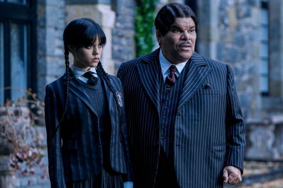 Wednesday. (L to R) Jenna Ortega as Wednesday Addams, Luis Guzmán as Gomez Addams in episode 101 of Wednesday. Cr. Vlad Cioplea/Netflix © 2022