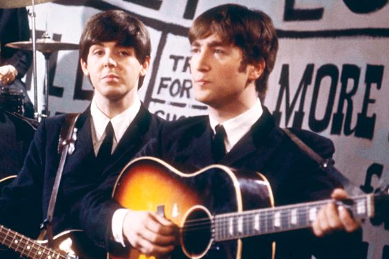 Paul McCartney and John Lennon of the The Beatles perform on Granada Television's Late Scene Extra programme at Granada television studios in Manchester, England on November 25th 1963.