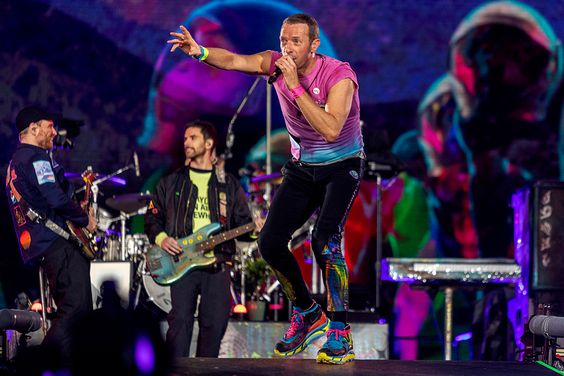Chris Martin, Guy Berryman and Jonny Buckland of Coldplay perform live on stage at Parken Stadium on July 5, 2023 in Copenhagen, Denmark.