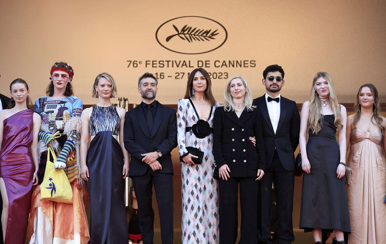 Actress Ksenia Devriendt, actor Luke Barker, Australian actress Mia Wasikowska, French actor Mathieu Demy, French actress Elsa Zylberstein, Austrian film director Jessica Hausner, Egyptian-British actor Amir El-Masry, actress Florence Baker and actress Gwen Currant arrive for the screening of the film "Club Zero" during the 76th edition of the Cannes Film Festival in Cannes, southern France, on May 22, 2023