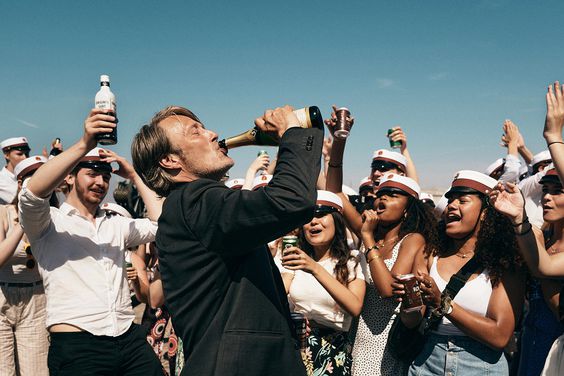 Mads Mikkelsen drinking in 'Another Round'