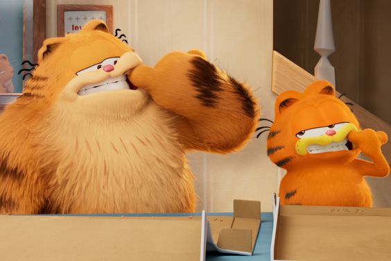 Garfield (voiced by Chris Pratt). and his dad (voiced by Samuel L. Jackson) in THE GARFIELD MOVIE.