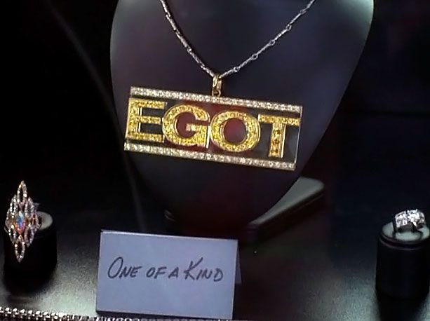 EGOT verb, noun A term invented by Miami Vice 's Philip Michael Thomas and co-opted by Tracy to describe the achievement of winning an Emmy,