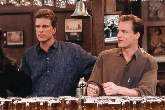 CHEERS -- "It's a Wonderful Wife" Episode 19 -- Aired 02/28/91 --Pictured: (l-r) Ted Danson as Sam Malone, Woody Harrelson as Woody Boyd
