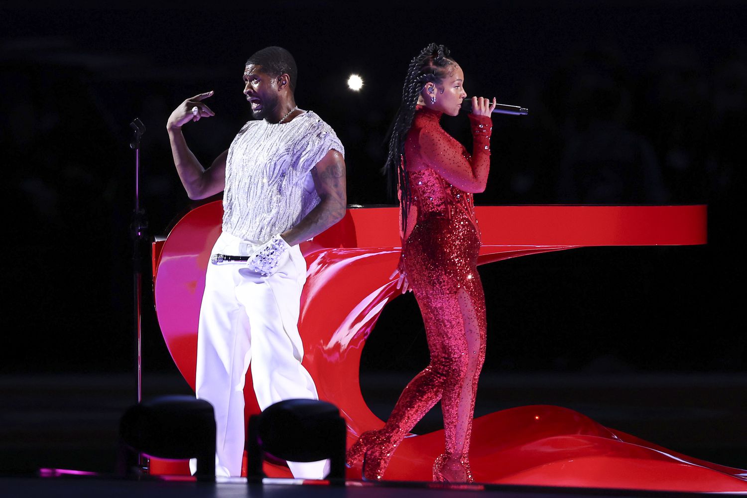 LAS VEGAS, NEVADA - FEBRUARY 11: (L-R) Usher and Alicia Keys perform onstage during the Apple Music Super Bowl LVIII Halftime Show at Allegiant Stadium on February 11, 2024 in Las Vegas, Nevada. (Photo by Steph Chambers/Getty Images)