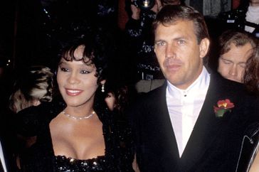 Singer Whitney Houston, actor Kevin Costner and wife Cindy Costner attend "The Bodyguard" Hollywood Premiere on November 23, 1992 at Mann's Chinese Theatre in Hollywood, California. (