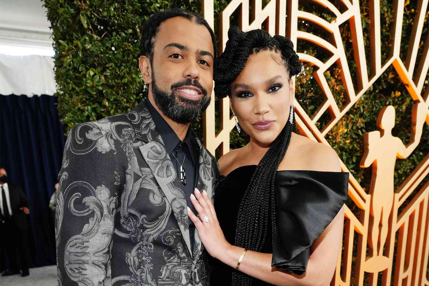 Daveed Diggs and Emmy Raver-Lampman attend the 28th Screen Actors Guild Awards at Barker Hangar on February 27, 2022 in Santa Monica, California