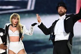 Taylor Swift is joined on stage by Travis Kelce (R), during "Taylor Swift | The Eras Tour" at Wembley Stadium on June 22, 2024 in London, England.