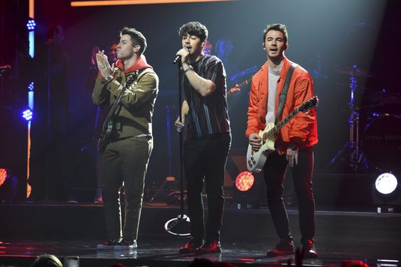 NEW YORK, NEW YORK - MAY 16: (L-R) Nick Jonas, Joe Jonas, and Kevin Jonas of The Jonas Brothers speak onstage during the The CW Network 2019 Upfronts at New York City Center on May 16, 2019 in New York City. (Photo by Kevin Mazur/Getty Images for The CW Network)