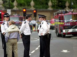 Police cordon off a road near Buckingham Palace in London after a fire broke out in the loft of the building Sunday June 2, 2002. The Palace is the center of Britain's Queen Elizabeth II's Golden Jubilee celebrations and the venue of a pop music concert scheduled for Monday. The fire was contained and there were no casualties.