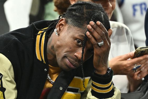 US rap artist Travis Scott gestures as he attends the men's semi-final basketball match between France and Germany during the Paris 2024 Olympic Games at The Bercy Arena in Paris on August 8, 2024