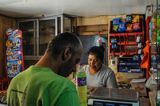 A kiosk where many snacks bear the black warning logos denoting items high in sugar, salt, calories or saturated fat, in Santiago, Chile.