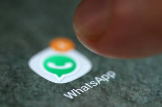 FILE PHOTO: The WhatsApp app logo is seen on a smartphone in this illustration