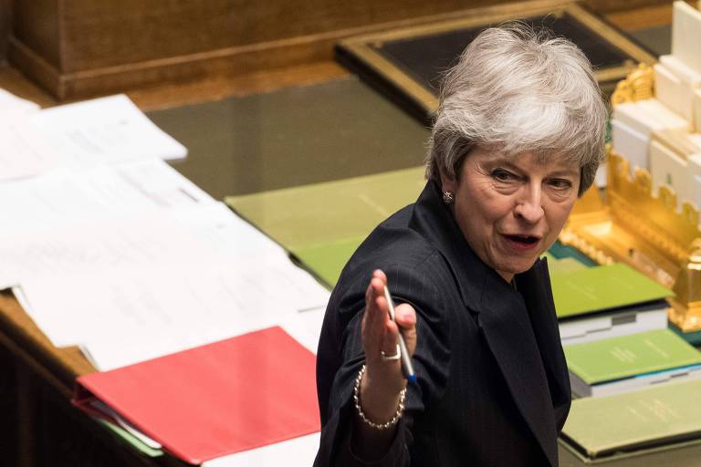 A primeira-ministra Theresa May durante os debates no Parlamento britânico nesta quarta (20) 