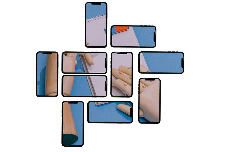 Vários celulares montam a imagem de uma mão de boneco com um bloco de notas e uma borracha