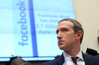FILE PHOTO: FILE PHOTO: Facebook Chairman and CEO Zuckerberg testifies at a House Financial Services Committee hearing in Washington