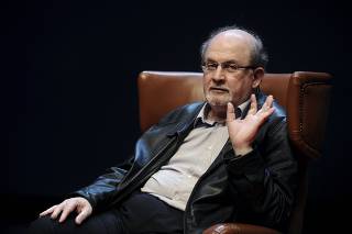 Author Rushdie gestures during a news conference before the presentation of his latest book 'Two Years Eight Months and Twenty-Eight Nights' at the Niemeyer Center in Aviles
